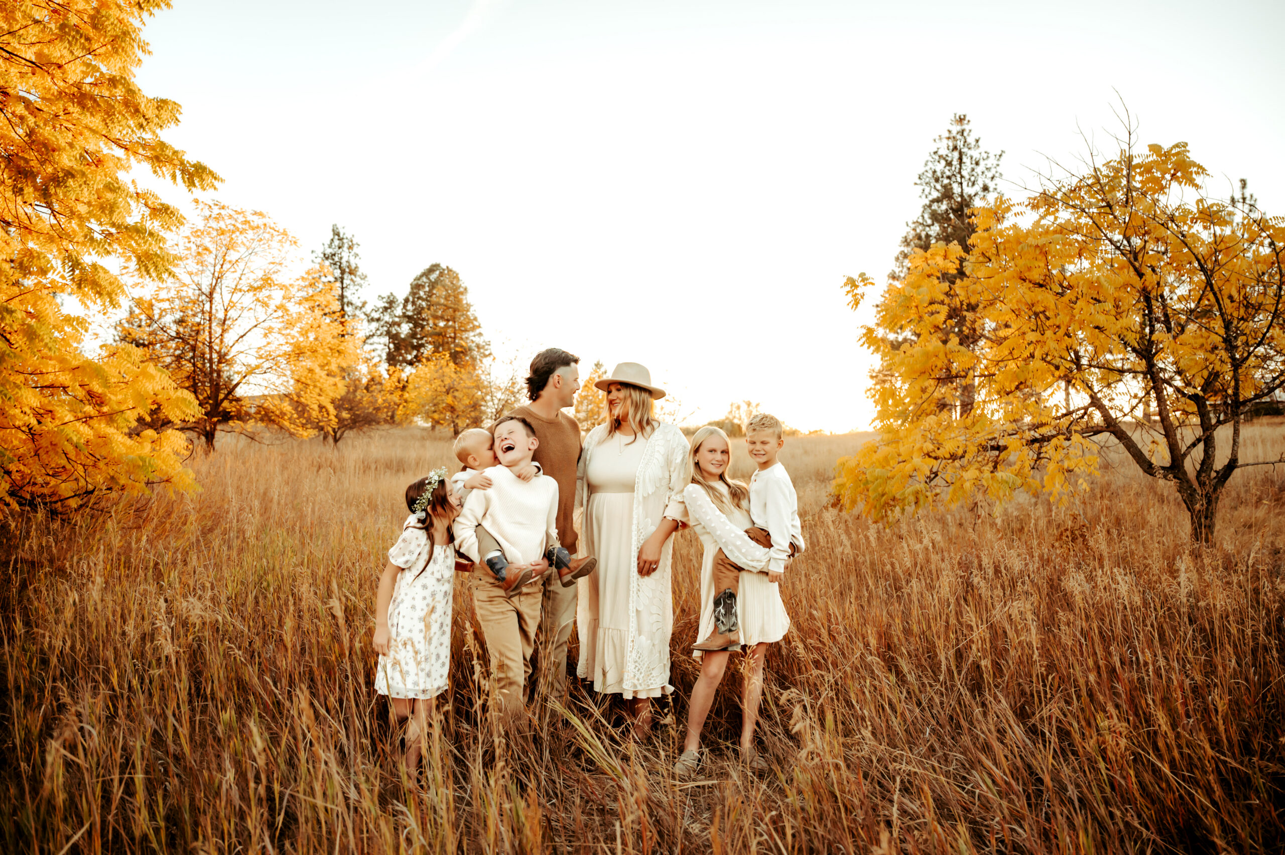 Spokane family cuddling on their property