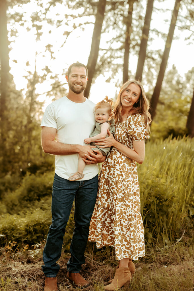 Family located in Spokane posing for a smile at golden hour
