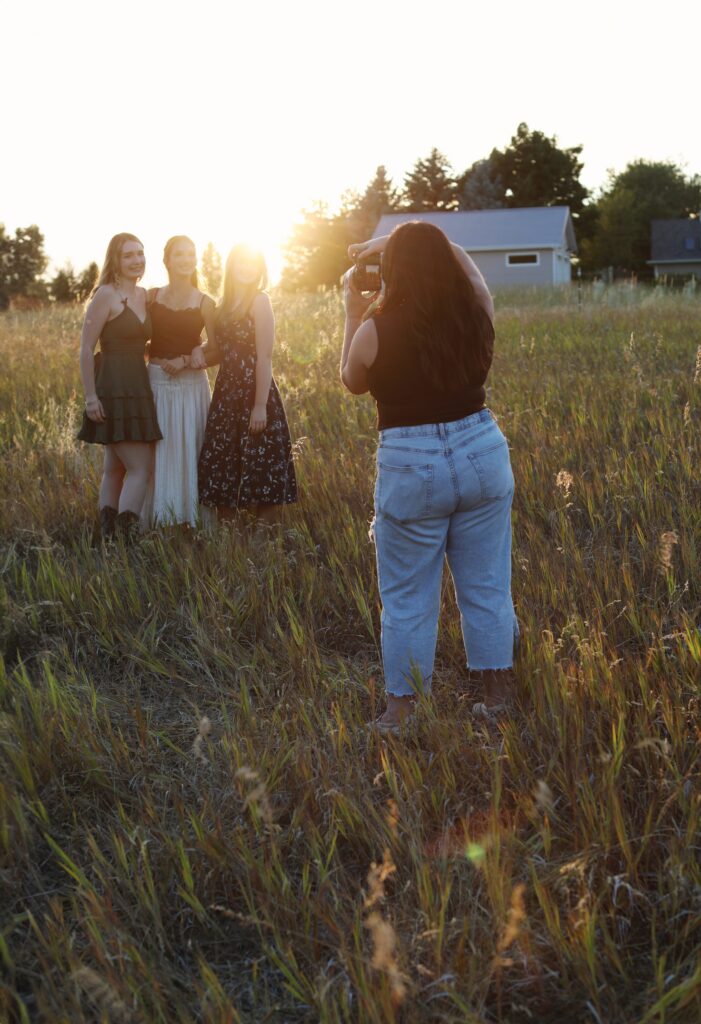 gently guiding a family during a relaxed outdoor photo session
